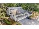 Aerial view of townhomes surrounded by lush greenery, showing well-maintained landscaping and private parking at 82 Twiggs Cor, Peachtree City, GA 30269