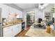 Modern kitchen with granite countertops, stainless steel appliances, and a view to the dining area at 82 Twiggs Cor, Peachtree City, GA 30269