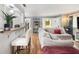 Bright living room with hardwood floors, a breakfast bar, and an open layout, ideal for modern living at 82 Twiggs Cor, Peachtree City, GA 30269