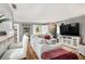 Comfortable living room featuring hardwood floors, a breakfast bar, and an open concept, creating a welcoming space at 82 Twiggs Cor, Peachtree City, GA 30269