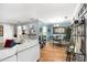 Open-concept living area with hardwood floors, breakfast bar, and access to the dining room, ideal for modern living at 82 Twiggs Cor, Peachtree City, GA 30269