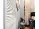 Interior view of a room with a desk with a computer and a white louvered door to a closet at 82 Twiggs Cor, Peachtree City, GA 30269