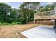 This home has a concrete patio and a wood deck in the backyard at 106 Adair Ave, Atlanta, GA 30315