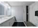 Bathroom boasts double vanity sinks, large mirrors, and modern tiled walk-in shower at 106 Adair Ave, Atlanta, GA 30315