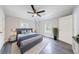 Spacious bedroom featuring a ceiling fan, two windows, and neutral decor to create a bright and inviting space at 106 Adair Ave, Atlanta, GA 30315