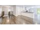 Spacious open-concept living room with high ceilings, modern lighting, and stained wood floors at 106 Adair Ave, Atlanta, GA 30315