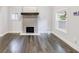 Spacious living room with hardwood floors, fireplace, and plenty of natural light at 106 Adair Ave, Atlanta, GA 30315