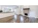 Open living space with view into kitchen, hardwood flooring, and fireplace at 106 Adair Ave, Atlanta, GA 30315