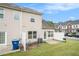 Townhouse exterior showcasing a fenced backyard with a lawn, patio, and a barbecue grill at 2555 Flat Shoals Rd # 801, Atlanta, GA 30349