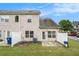 Townhouse exterior featuring a fenced backyard with lawn, patio, and a barbecue grill at 2555 Flat Shoals Rd # 801, Atlanta, GA 30349