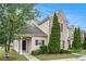 Townhome featuring landscaped front yard, attractive exterior elements, and inviting entrance at 2555 Flat Shoals Rd # 801, Atlanta, GA 30349
