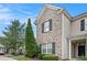 Close-up of brick and siding townhome, showcases architectural detail and landscaping at 2555 Flat Shoals Rd # 801, Atlanta, GA 30349