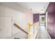 Hallway with hardwood floors and staircase at 2555 Flat Shoals Rd # 801, Atlanta, GA 30349