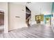 Spacious living room with hardwood floors, staircase, and views of kitchen at 2555 Flat Shoals Rd # 801, Atlanta, GA 30349