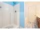 Simple bathroom shower area with blue accents at 2555 Flat Shoals Rd # 801, Atlanta, GA 30349