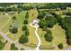 Aerial view of the estate showcasing the home, pool, and vast surrounding landscape at 3030 Berry Rd, Loganville, GA 30052