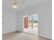 Bright bedroom with access to a sunroom, featuring a ceiling fan and neutral decor at 3030 Berry Rd, Loganville, GA 30052