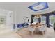Elegant dining room with a blue accent ceiling, chandelier, and decorative window treatments at 3030 Berry Rd, Loganville, GA 30052