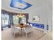 Inviting dining area with traditional wainscotting, decorative lighting, and a scenic backyard view at 3030 Berry Rd, Loganville, GA 30052