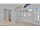 Bright foyer featuring double doors, a tiled floor, and staircase to the second floor at 3030 Berry Rd, Loganville, GA 30052