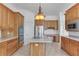 Spacious eat-in kitchen with stainless steel appliances, central island, and ample cabinets at 3030 Berry Rd, Loganville, GA 30052