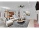Cozy living room featuring a fireplace, soft seating, and an open view to the kitchen at 3030 Berry Rd, Loganville, GA 30052