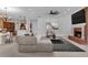 Open-concept living area featuring a fireplace, comfortable sofa, and inviting decor at 3030 Berry Rd, Loganville, GA 30052