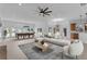 Expansive living room with a billiard table, sectional seating, and a view to the backyard at 3030 Berry Rd, Loganville, GA 30052