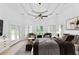 Spacious main bedroom with a ceiling fan, sitting area, and walk-out access at 3030 Berry Rd, Loganville, GA 30052