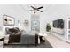 Spacious main bedroom with a ceiling fan, sitting area, and walk-out access at 3030 Berry Rd, Loganville, GA 30052