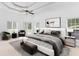 Spacious main bedroom with a ceiling fan, sitting area, and walk-out access at 3030 Berry Rd, Loganville, GA 30052