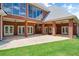Spacious covered patio with views of the manicured lawn at 3030 Berry Rd, Loganville, GA 30052