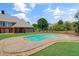 Backyard pool and spa surrounded by lush landscaping, perfect for outdoor entertaining at 3030 Berry Rd, Loganville, GA 30052