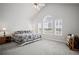Spacious bedroom with vaulted ceiling, large windows, and plush carpeting at 329 Acuba Vw, Woodstock, GA 30188