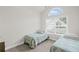 Well-lit bedroom with large window and vaulted ceiling at 329 Acuba Vw, Woodstock, GA 30188