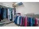 Walk-in closet with ample shelving and storage space for clothes at 329 Acuba Vw, Woodstock, GA 30188