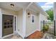 A close view of the home exterior including the front door, small yard, and stone pathway at 329 Acuba Vw, Woodstock, GA 30188