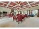 The interior features a neutral carpet, a coffered ceiling, and a fireplace with a TV nearby at 329 Acuba Vw, Woodstock, GA 30188