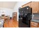 Bright eat-in kitchen with stainless steel appliances and hardwood floors at 329 Acuba Vw, Woodstock, GA 30188