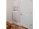 Compact laundry area featuring a stacked washer and dryer setup for convenient in-home laundry at 329 Acuba Vw, Woodstock, GA 30188