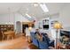 Open concept living room with skylights, built-in shelving, fireplace and hardwood flooring at 329 Acuba Vw, Woodstock, GA 30188