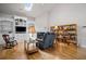 Comfortable living room with built-in shelving, hardwood floors, and a fireplace at 329 Acuba Vw, Woodstock, GA 30188