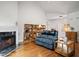 A view of the living room, fireplace, hardwood floors, and comfortable furniture at 329 Acuba Vw, Woodstock, GA 30188