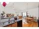Bright open concept showcases the modern kitchen, breakfast bar and dining area at 329 Acuba Vw, Woodstock, GA 30188