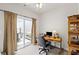 Bright home office featuring a sliding glass door to a stone patio at 329 Acuba Vw, Woodstock, GA 30188