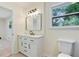Bright bathroom with a modern vanity and a sleek mirror at 8432 Magnolia Dr, Jonesboro, GA 30238