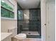 Bathroom with a new glass shower door and modern tiling at 8432 Magnolia Dr, Jonesboro, GA 30238