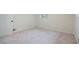Well-lit bedroom with cozy carpet and neutral wall paint at 8432 Magnolia Dr, Jonesboro, GA 30238