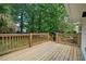 Well-maintained wooden deck overlooking a lush, green backyard, perfect for outdoor entertaining at 8432 Magnolia Dr, Jonesboro, GA 30238
