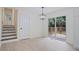 Dining area with sliding glass doors leading to a wooden deck and backyard views at 8432 Magnolia Dr, Jonesboro, GA 30238